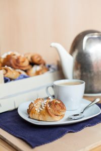 A typical Finnish bun, a cinnamon roll heady with cardamom and served with coffee. The name roughly translates as 'slapped ears', possibly due to it's unique shape.